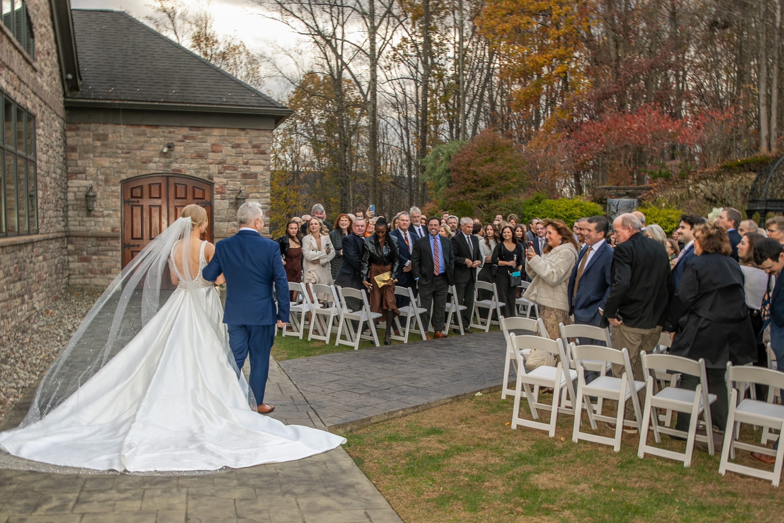 Bride and father pausing at the aisle before walking down the aisle during a wedding ceremony